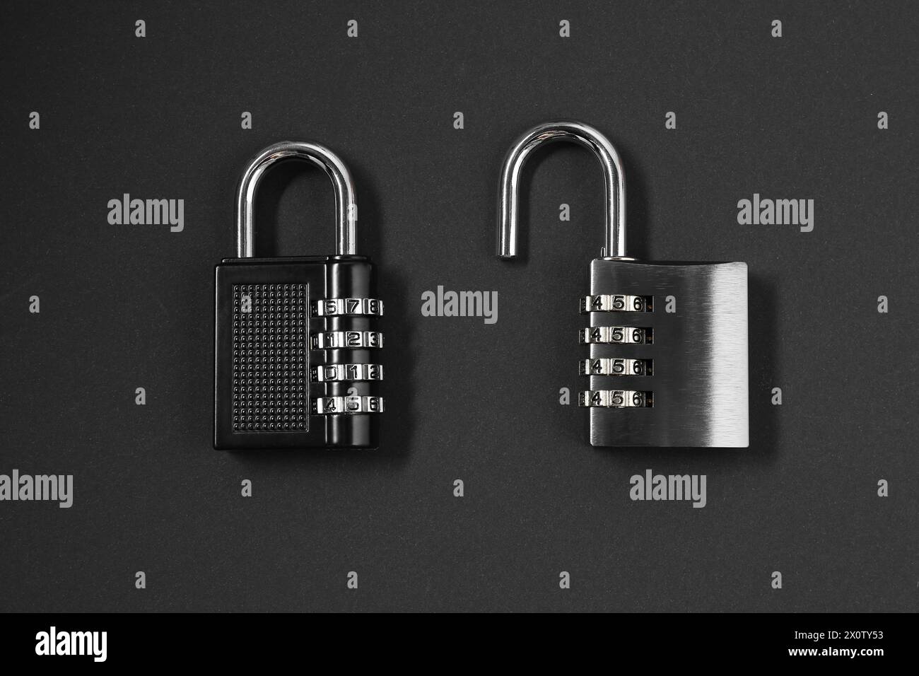 Steel combination padlocks on black background, top view Stock Photo