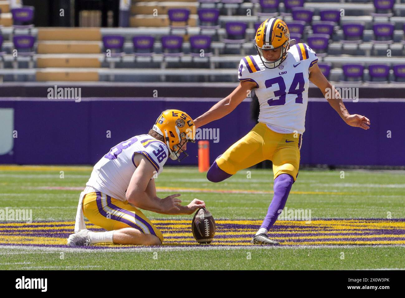 Baton Rouge, LA, USA. 13th Apr, 2024. LSU placekicker Damian Ramos (34) attempts a field goal out of the hold of teammate Peyton Todd (38) during the annual National L Club LSU Spring Game at Tiger Stadium in Baton Rouge, LA. Jonathan Mailhes/CSM (Credit Image: © Jonathan Mailhes/Cal Sport Media). Credit: csm/Alamy Live News Stock Photo