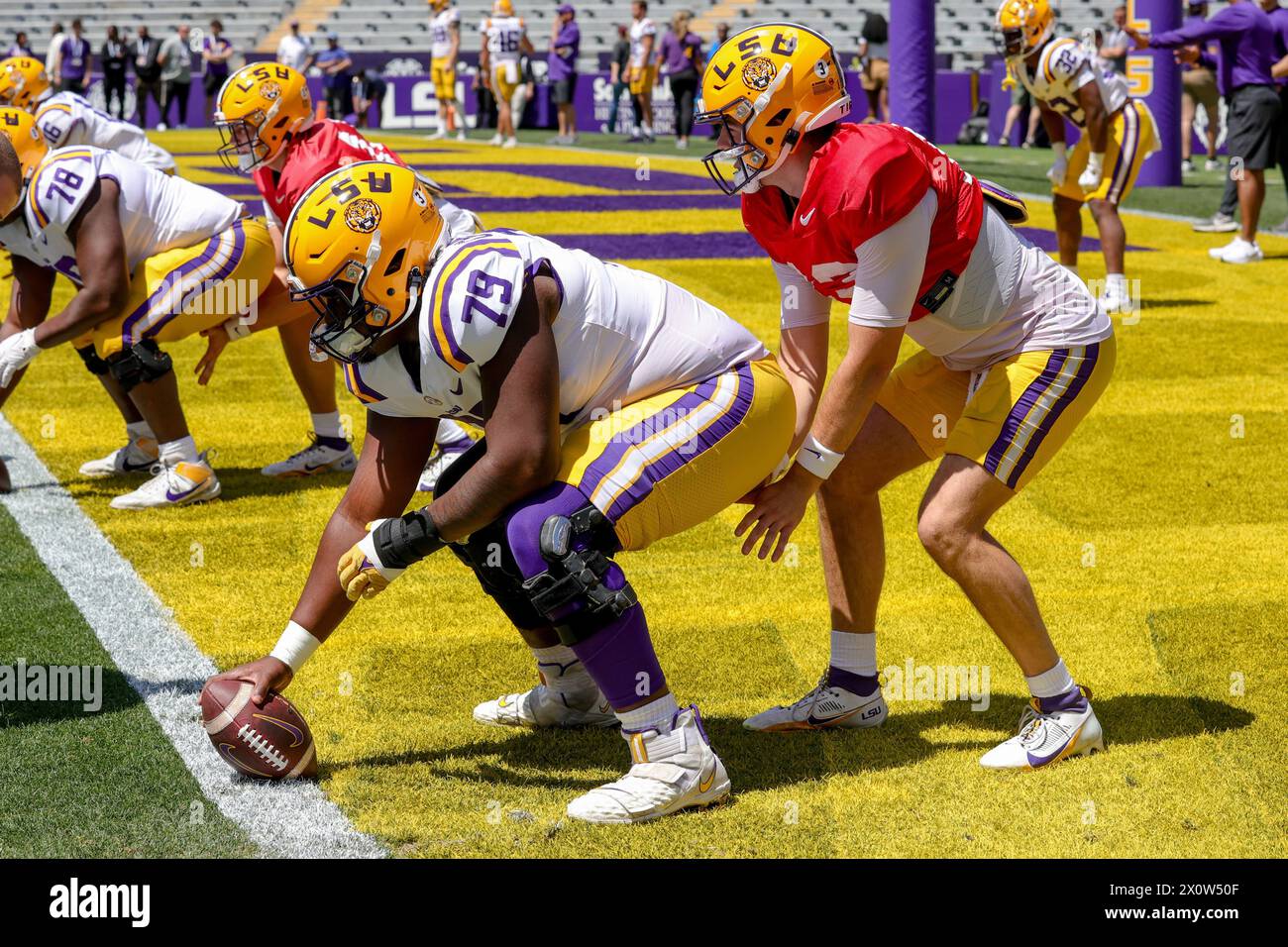 Baton Rouge, LA, USA. 13th Apr, 2024. LSU offensive lineman DJ Chester (79) gets ready to snap the ball to quarterback Garrett Nussmeier (13) during the annual National L Club LSU Spring Game at Tiger Stadium in Baton Rouge, LA. Jonathan Mailhes/CSM/Alamy Live News Stock Photo