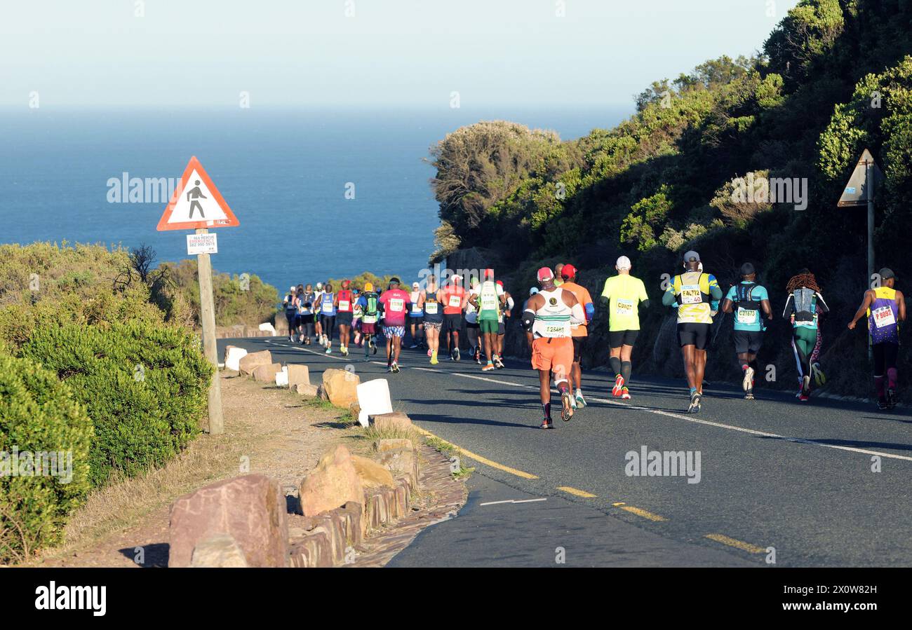 Cape Town, South Africa. 13th Apr, 2024. Participants run during the 2024 Two Oceans Marathon in Cape Town, South Africa, April 13, 2024. The Two Oceans Marathon, which is run against a backdrop of spectacular scenery through the Cape Peninsula, has earned a reputation as 'the world's most beautiful marathon.' Credit: Ian Landsberg/Xinhua/Alamy Live News Stock Photo