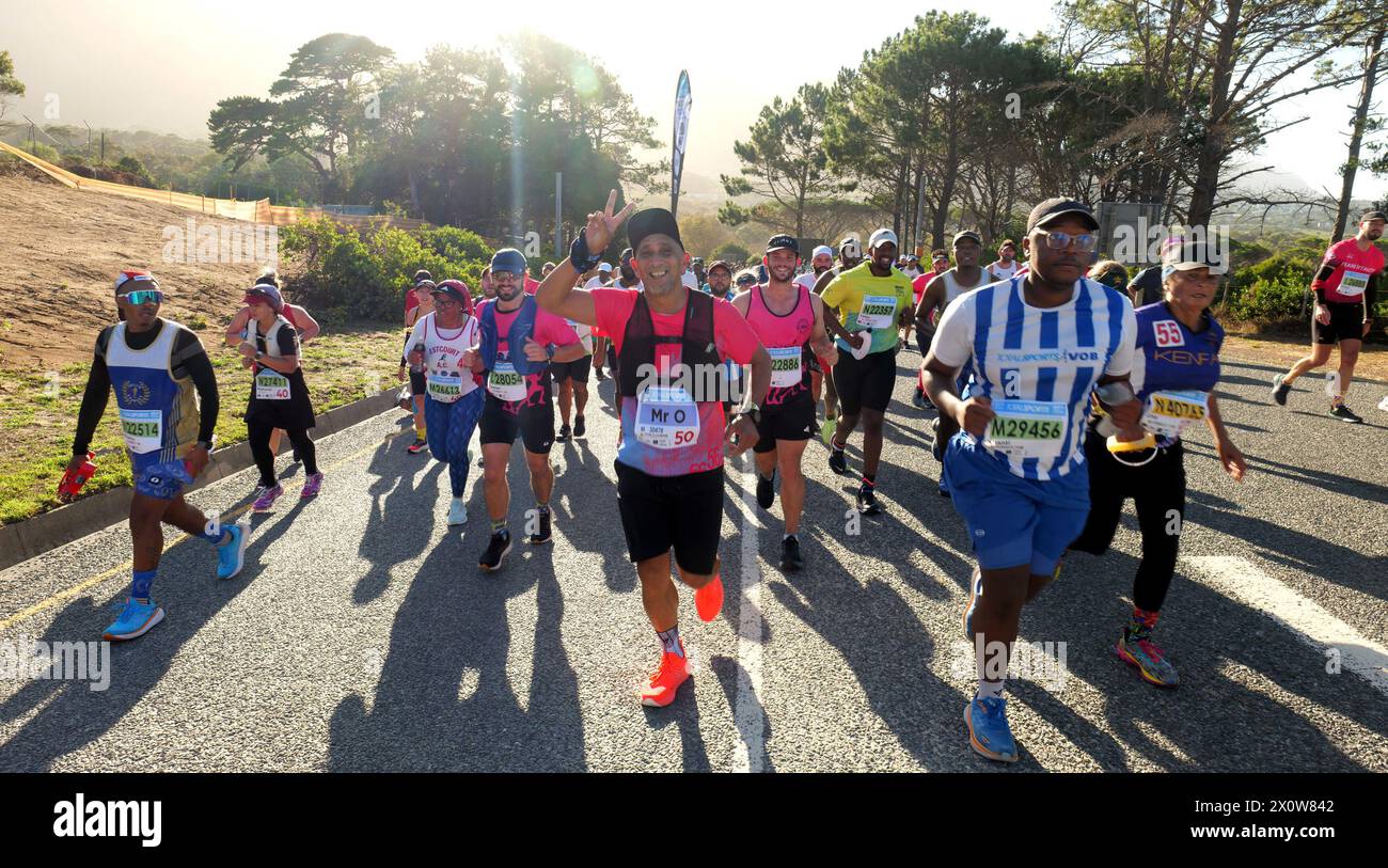 Cape Town, South Africa. 13th Apr, 2024. Participants run during the 2024 Two Oceans Marathon in Cape Town, South Africa, April 13, 2024. The Two Oceans Marathon, which is run against a backdrop of spectacular scenery through the Cape Peninsula, has earned a reputation as 'the world's most beautiful marathon.' Credit: Ian Landsberg/Xinhua/Alamy Live News Stock Photo