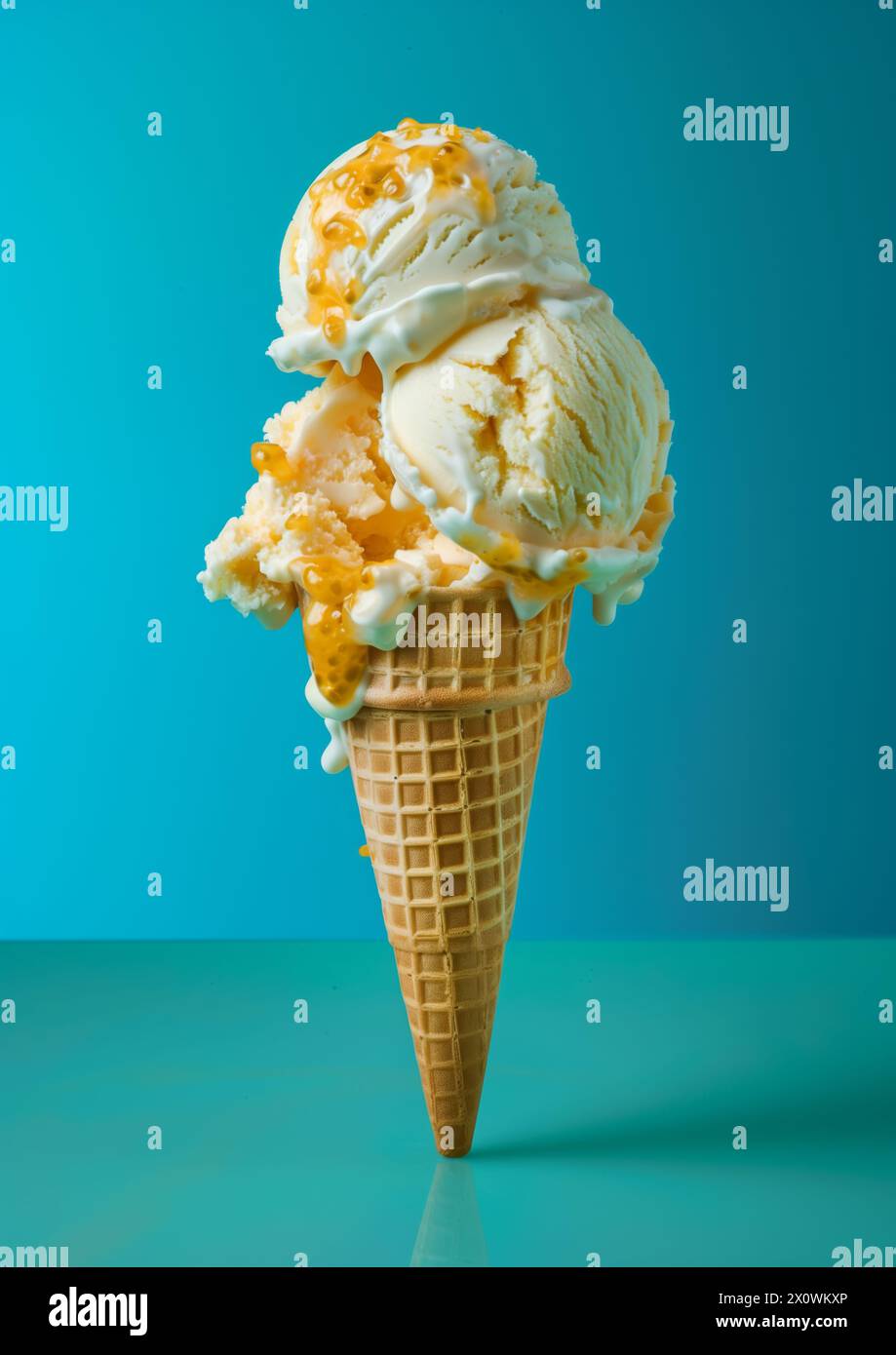 Two scoops of Vanilla ice cream on top ice cream cone blue background ...