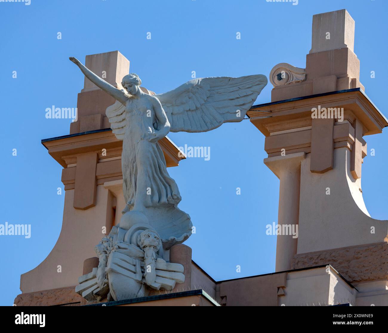 GENOVA, ITALY, JULY 26, 2023 - Victory Angel statue of the fascist regime on the top of an historic building of Genoa, Italy Stock Photo