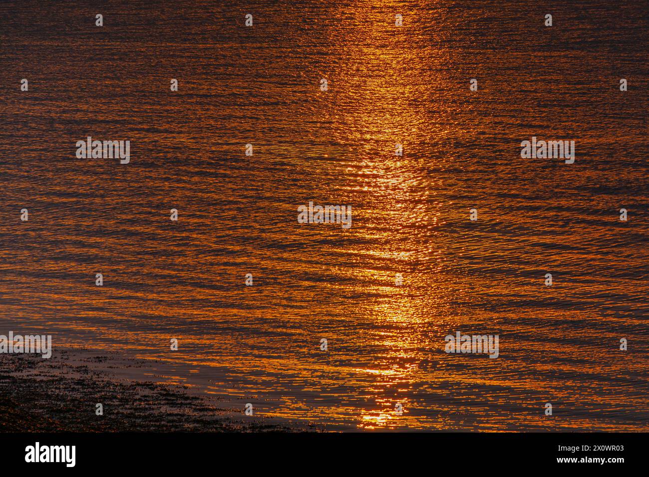 Sunlight reflecting onto the sea Stock Photo