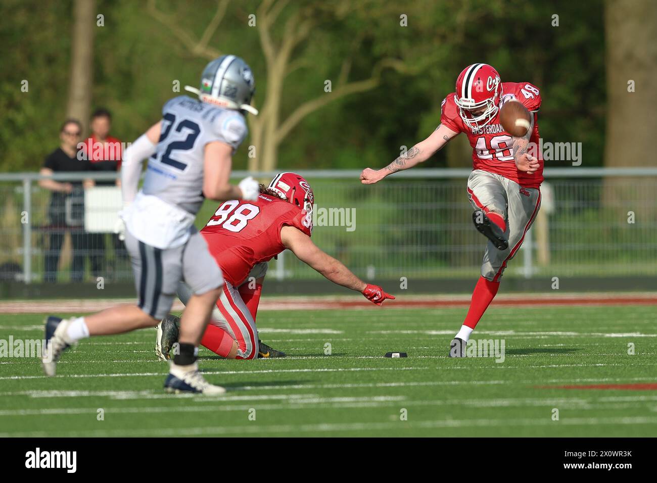 AMSTERDAM, NETHERLANDS - APRIL 13: Dylan Bakker of Amsterdam Crusaders, Jurre van der Pal of Amsterdam Crusaders during the friendly American football Stock Photo