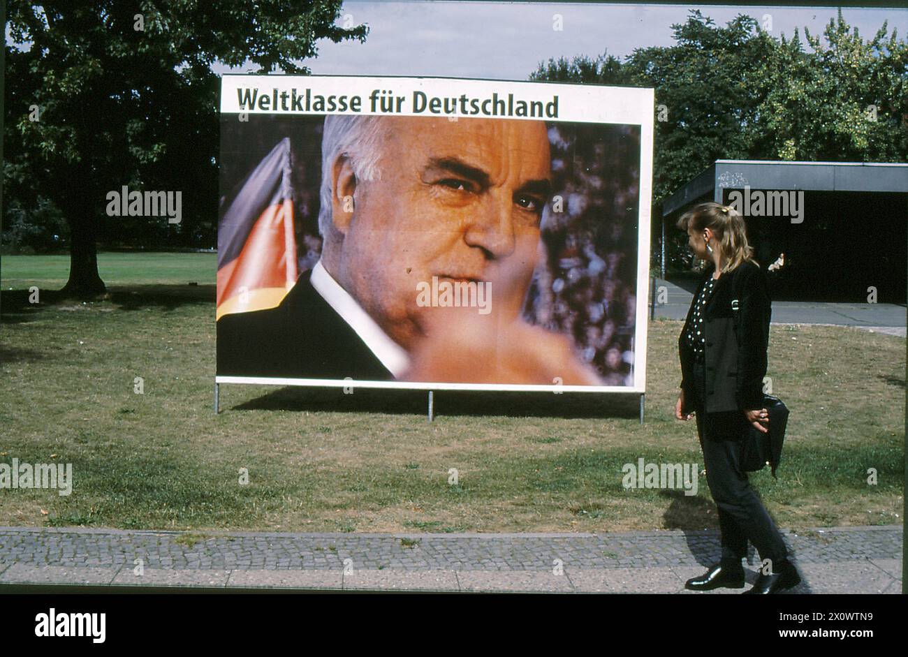 Berlin/Brandenburg/Germany/Billboards of Helmut Josef Michael Kohl, Geerman canchellor and leader of CDU been vandelized during general eelctions compiagn in Berlain and other billbaards are SPD are fine and people infront billboard in Berlin Brad nenburg Germany    (Photo.Francis Joseph Dean/Dean Pictures) Stock Photo