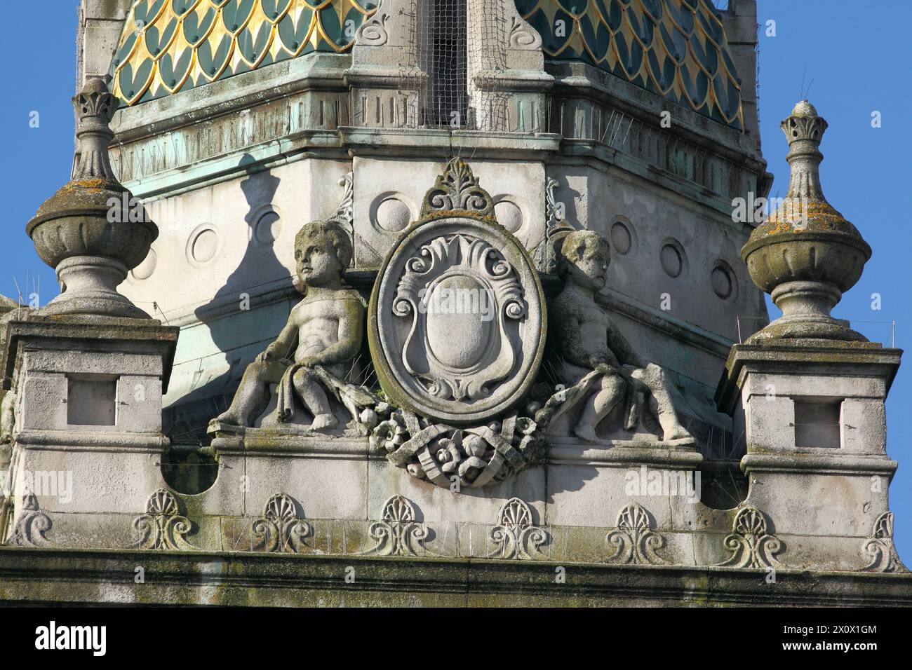 Close up of a cartouche flanked by putti on top of the Clock Tower in the centre of Brighton. Stock Photo