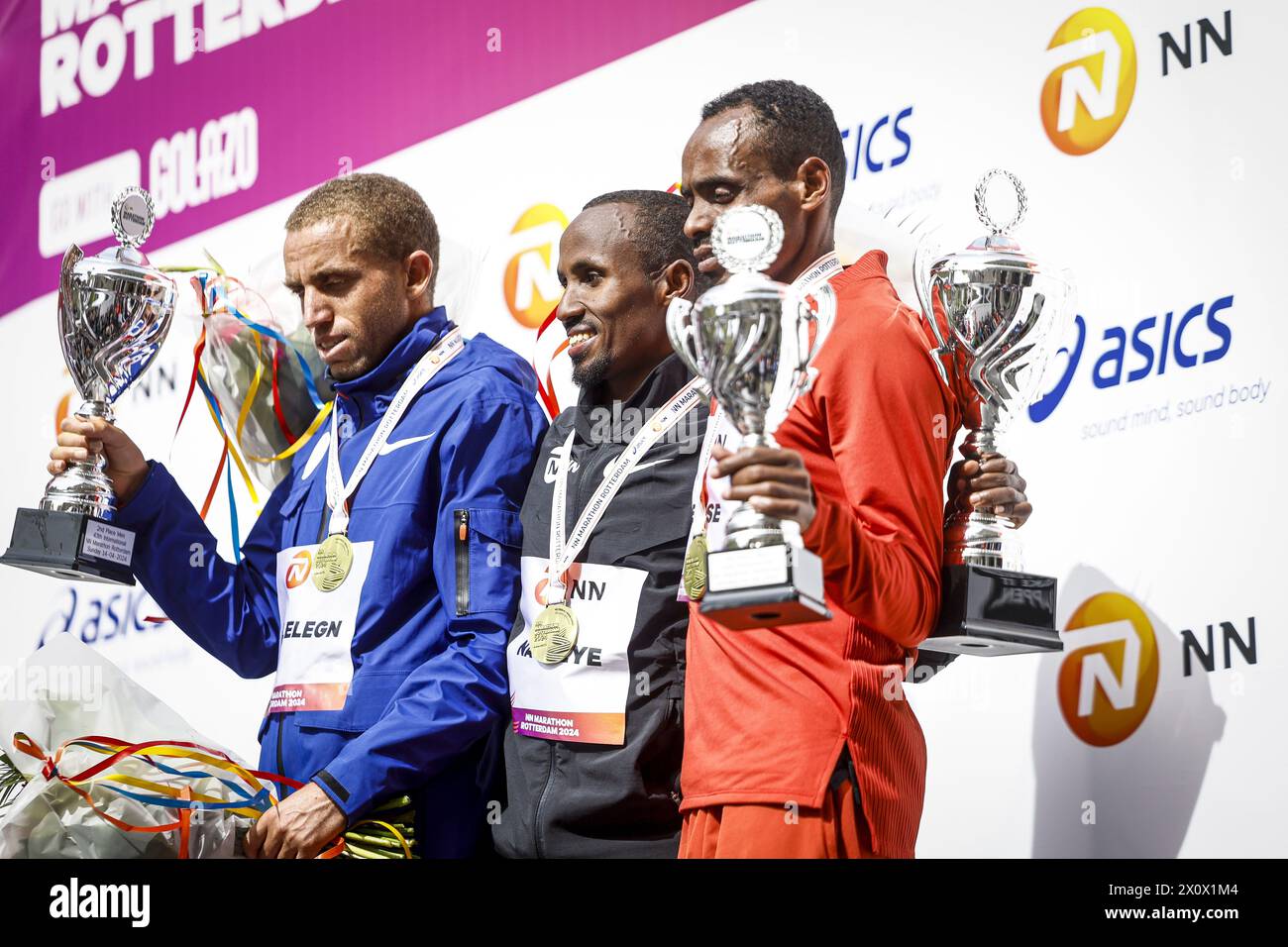 ROTTERDAM - (l-r) Amedework Walelegn (second), Abdi Nageeye (first), Birhanu Legese (third) on the podium after the 43rd edition of the NN Marathon Rotterdam on April 14, 2024 in Rotterdam, Netherlands. ANP IRIS VAN DEN BROEK Stock Photo