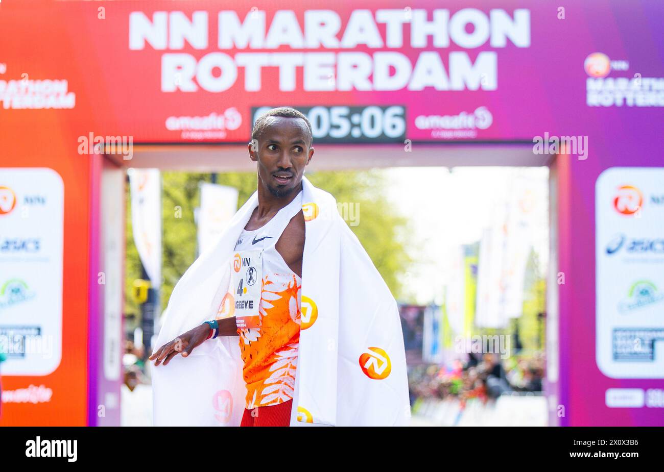 ROTTERDAM - Abdi Nageeye at the finish of the 43rd edition of the NN Marathon Rotterdam on April 14, 2024 in Rotterdam, the Netherlands. ANP IRIS VAN DEN BROEK Stock Photo