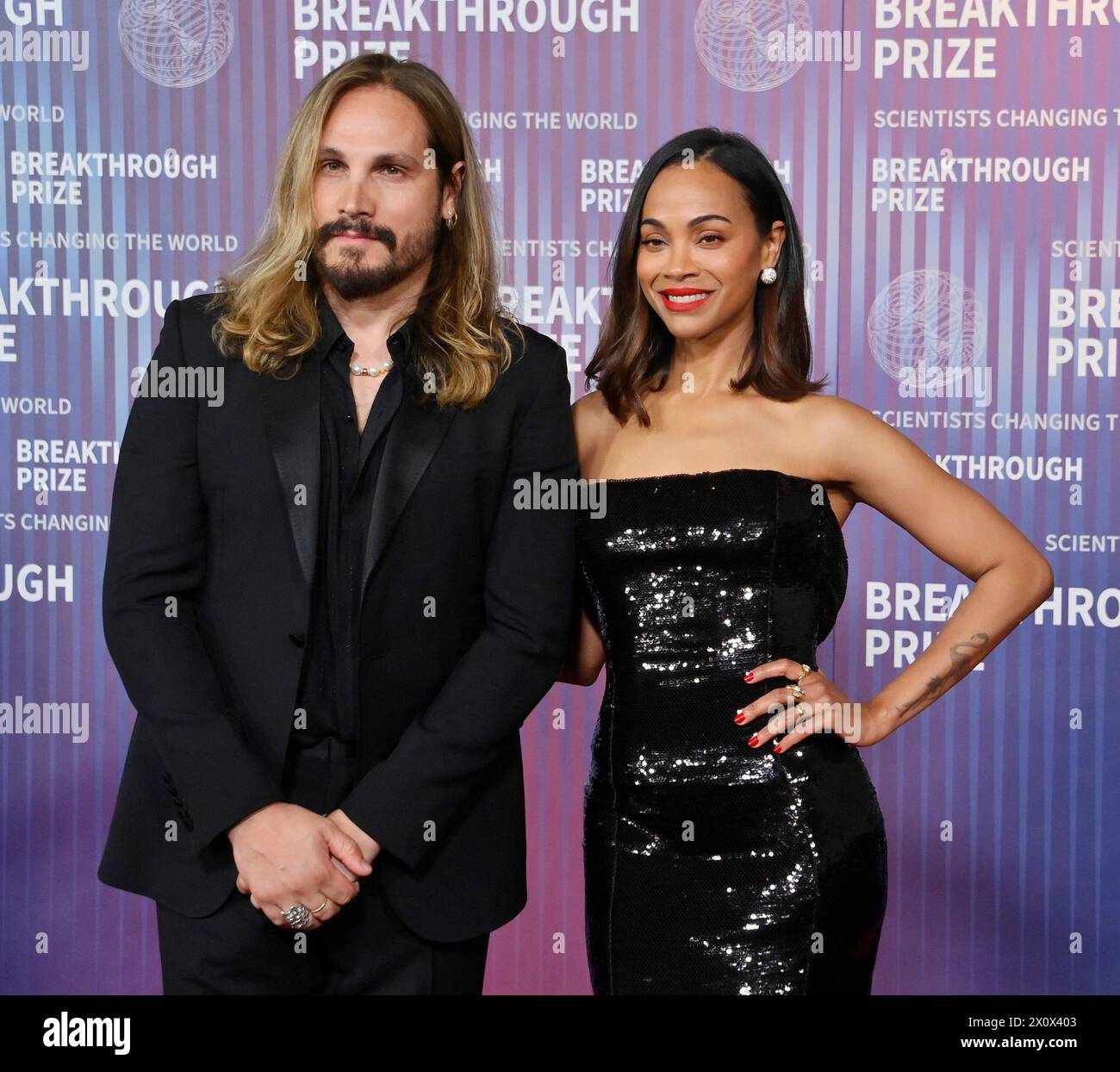 Zoe Saldana (R) and Marco Perego attend the 10th annual Breakthrough