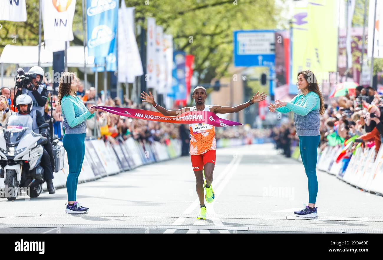 ROTTERDAM - Abdi Nageeye at the finish of the 43rd edition of the NN Marathon Rotterdam on April 14, 2024 in Rotterdam, the Netherlands. ANP IRIS VAN DEN BROEK Stock Photo