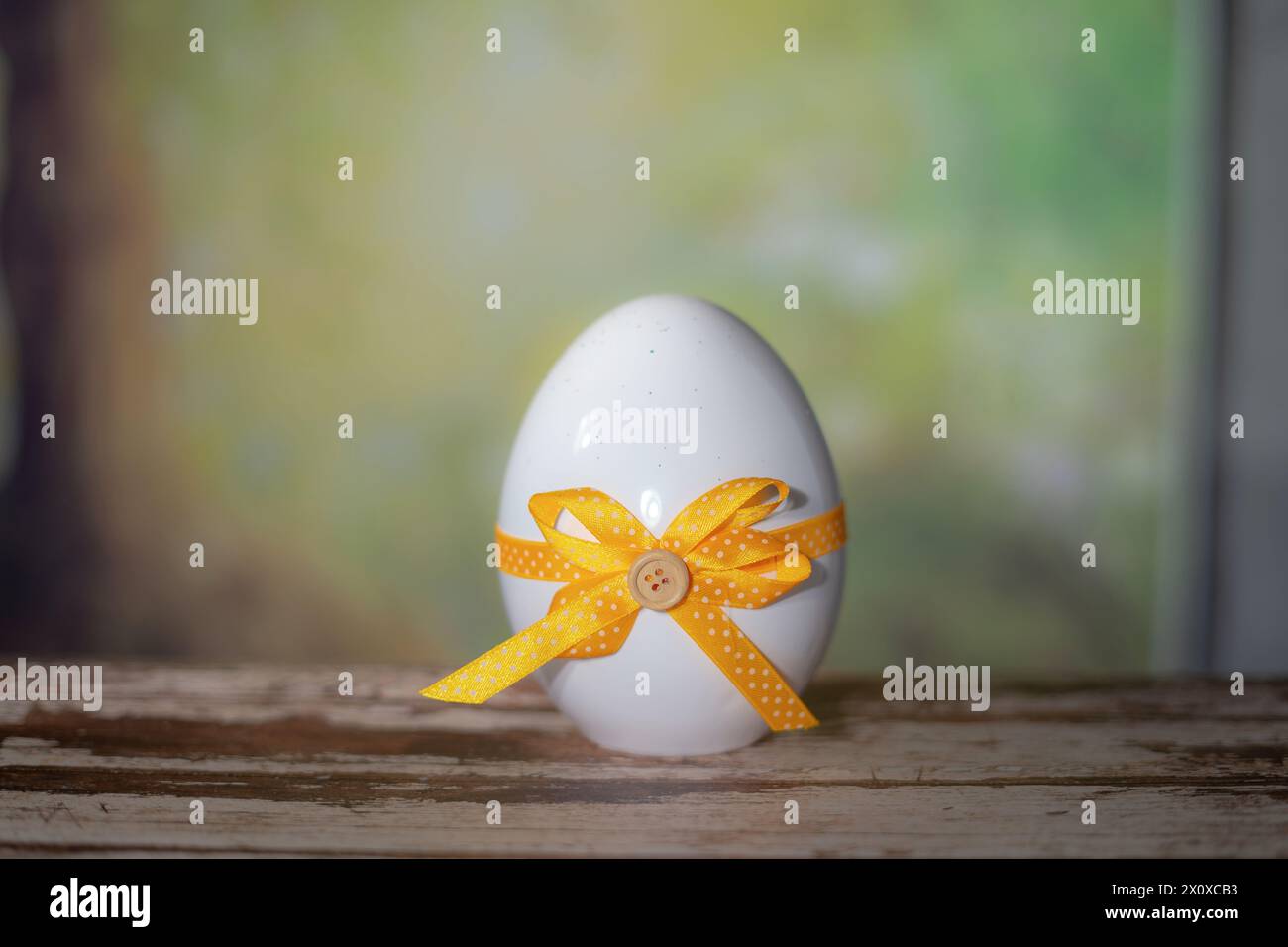 Eggs wrapped in a colorful gift tie. Easter, Pascha or Resurrection Sunday concept Stock Photo