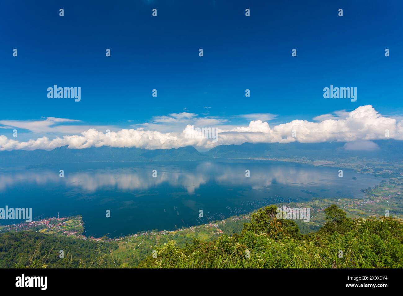 Lake Maninjau is a caldera lake in West Sumatra, Indonesia. It is located 36 kilometres to the west of Bukittinggi Stock Photo