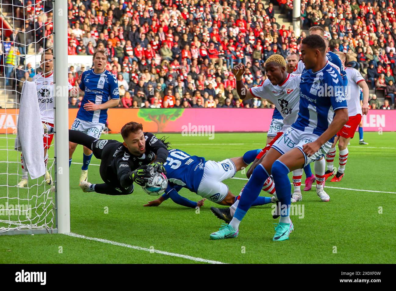Fredrikstad, Norway, 13nd April 2024.  Sarpsborg 08's goalkeeper Marko Ilic makes a fine save in the Eliteserien match between Fredrikstad and Sarpsborg 08 at Fredrikstad stadium.  Credit: Frode Arnesen/Alamy Live News Stock Photo