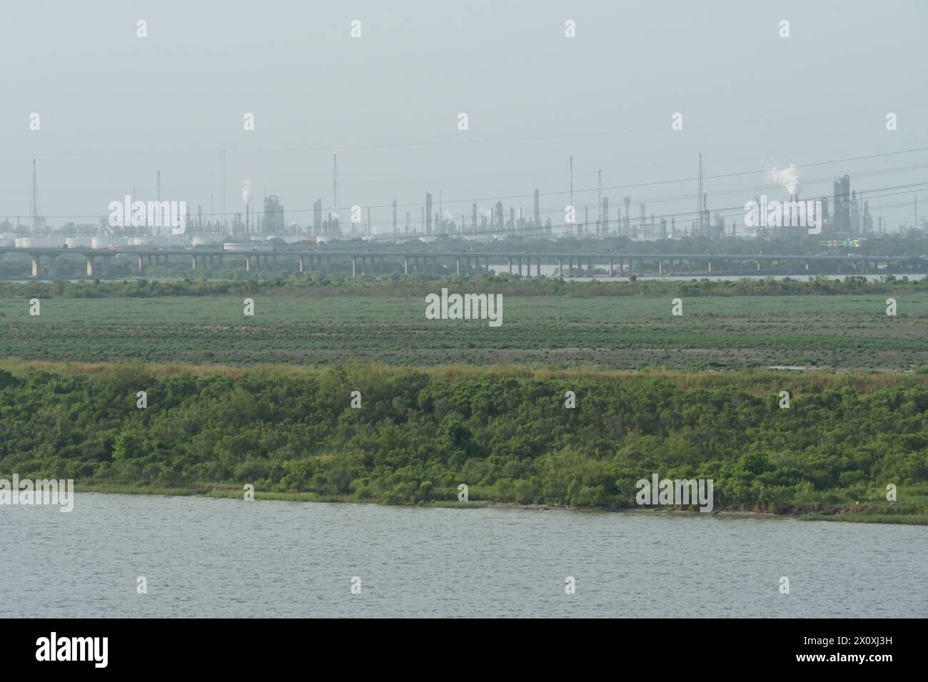 Industrial zone with factories and refineries observed from the container terminal of the Port of Houston. Stock Photo