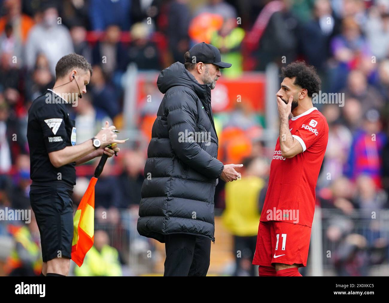 Liverpool manager Jurgen Klopp instructs Mohamed Salah on the touchline during the Premier League match at Anfield, Liverpool. Picture date: Sunday April 14, 2024. Stock Photo