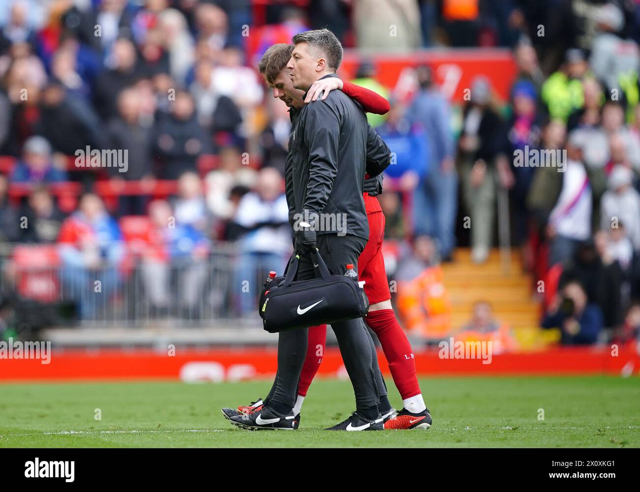 Liverpool's Conor Bradley leaves the pitch after picking up an injury during the Premier League match at Anfield, Liverpool. Picture date: Sunday April 14, 2024. Stock Photo