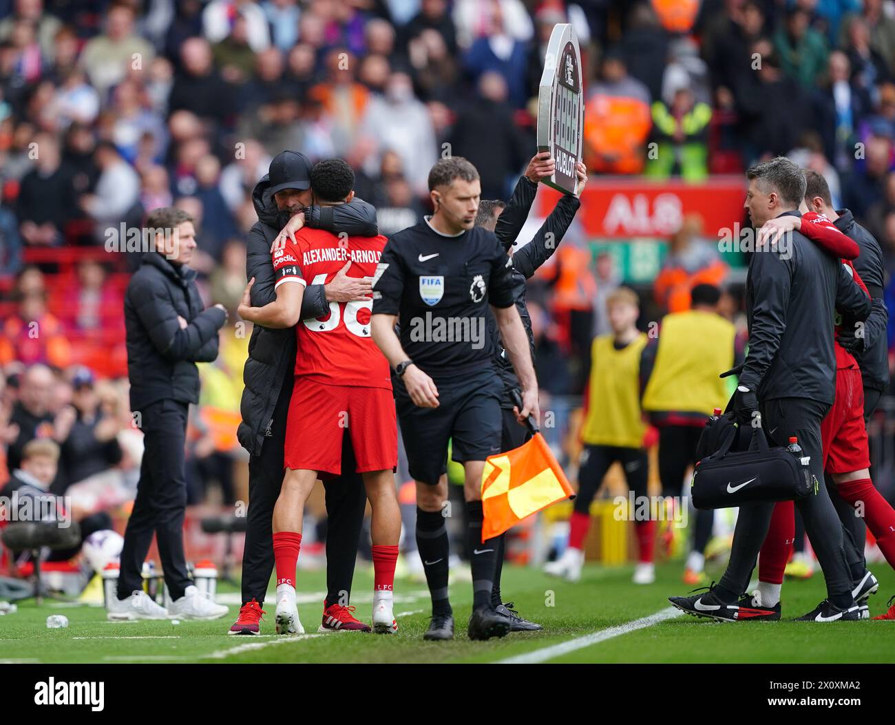Liverpool manager Jurgen Klopp hugs Trent Alexander-Arnold as an injured Conor Bradley leaves the pitch during the Premier League match at Anfield, Liverpool. Picture date: Sunday April 14, 2024. Stock Photo