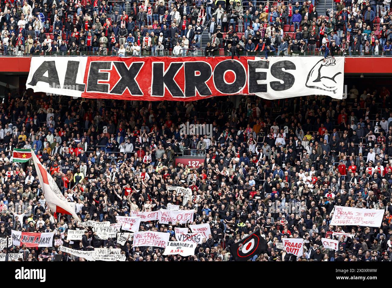 AMSTERDAM - (l-r) Banner pro Alex Kroes and banners against Ajax RVC chairman Michael van Praag during the Dutch Eredivisie match between Ajax Amsterdam and FC Twente at the Johan Cruijff ArenA on April 14, 2024 in Amsterdam, Netherlands. ANP | Hollandse Hoogte | MAURICE VAN STEEN Stock Photo