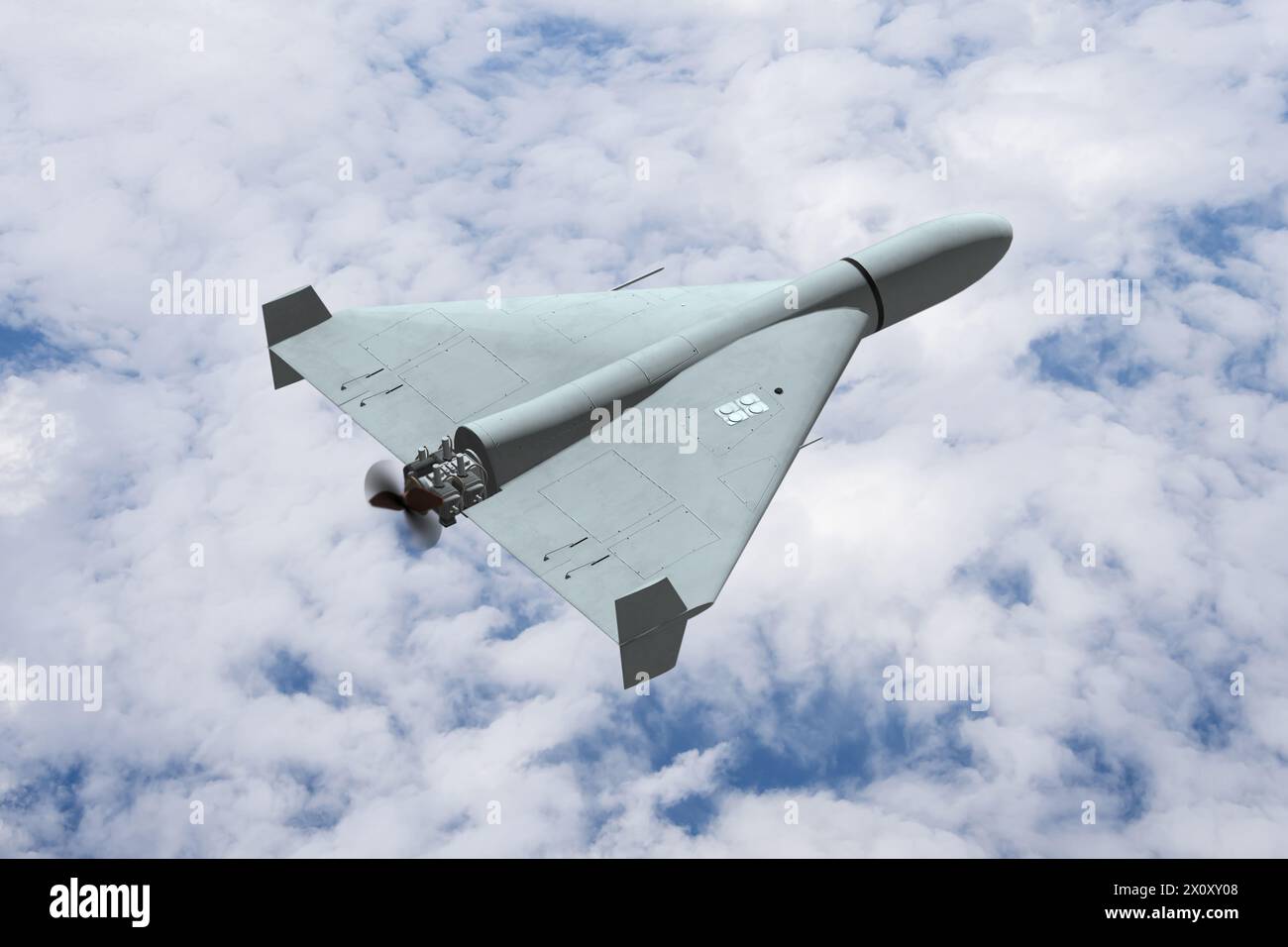Military drone in the sky above the clouds, drone attack. Concept: military conflict. Stock Photo