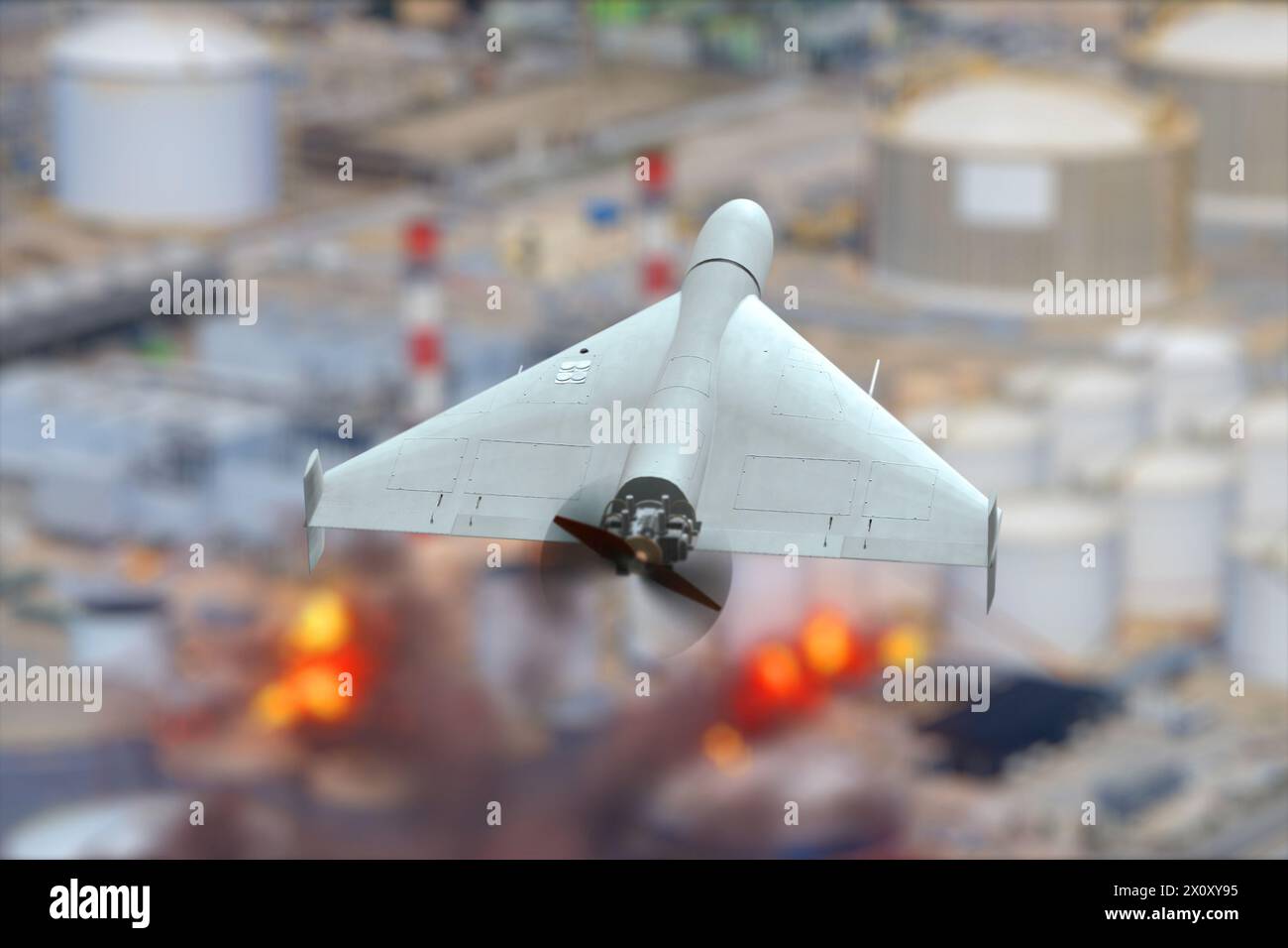 Military drone attack on oil refinery, oil depot fire, explosions and fire. Stock Photo