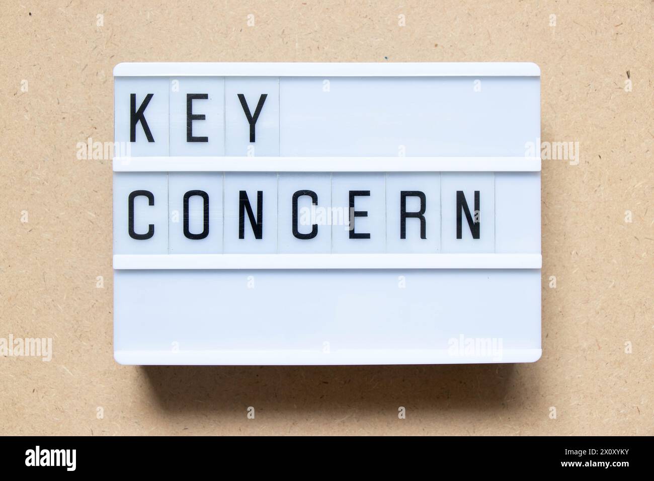 Lightbox with word key concern on wood background Stock Photo
