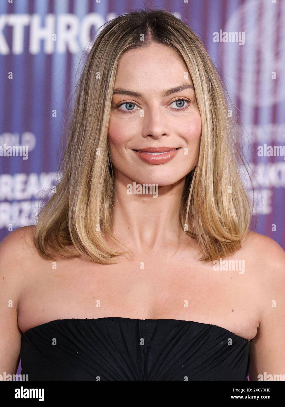 LOS ANGELES, CALIFORNIA, USA APRIL 13 Margot Robbie wearing Rick