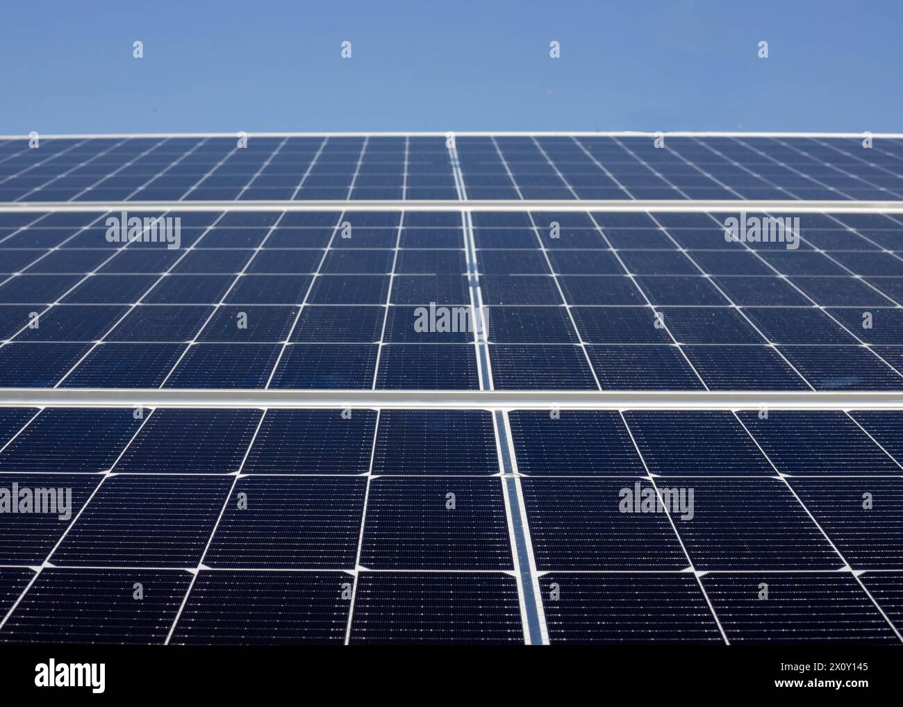 Solar panels with a blue sky background. Alternative clean electricity source in Pakistan. Stock Photo