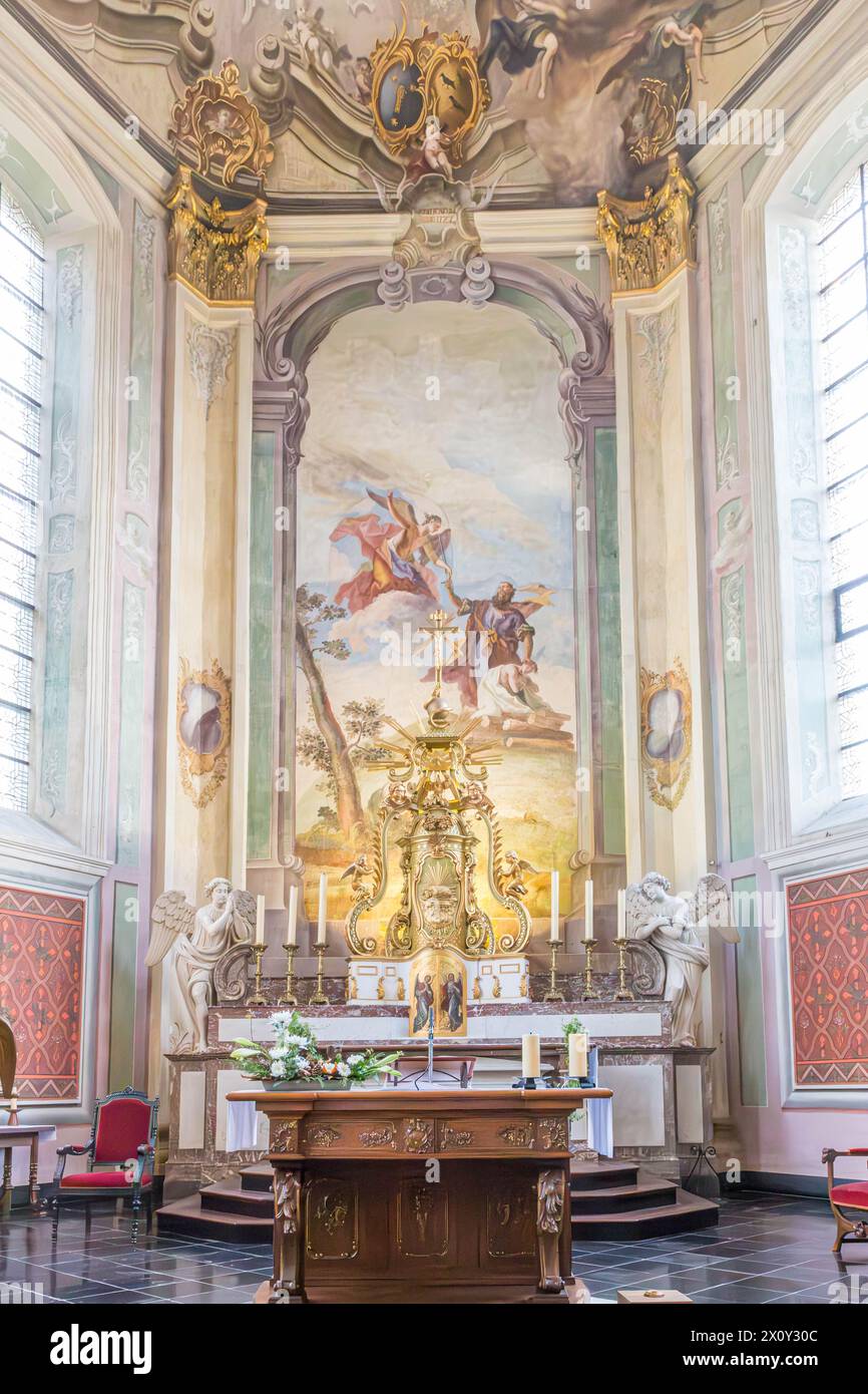 Valkenburg aan de Geul, South Limburg, Netherlands. November 1, 2014. Altar inside the church of Saint Gerlachus with a fresco, between two large wind Stock Photo