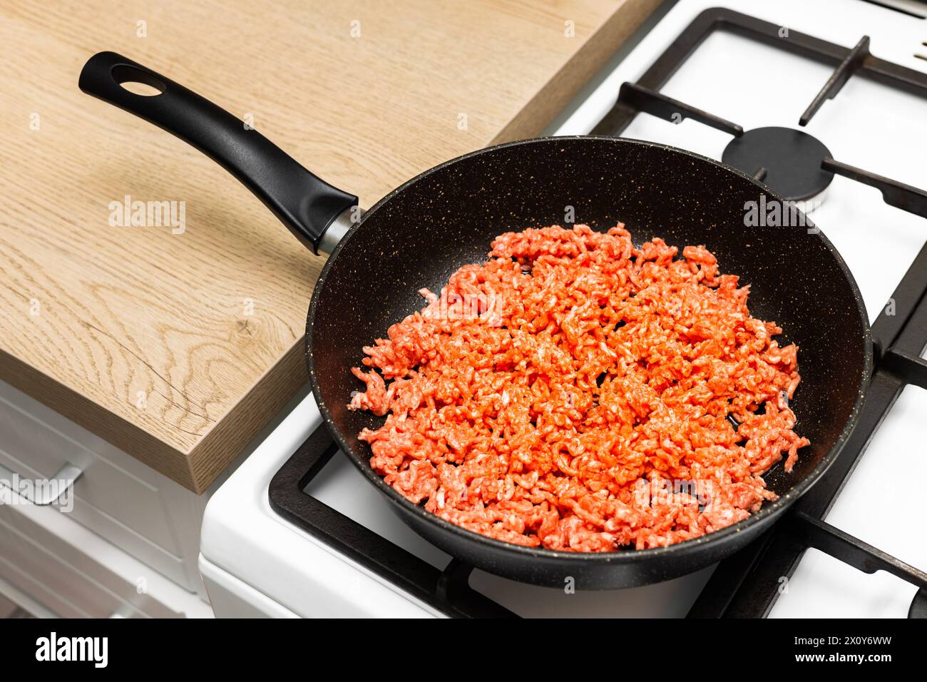 fresh minced meat lies on a frying pan. frying minced meat. raw minced meat. High quality photo Stock Photo