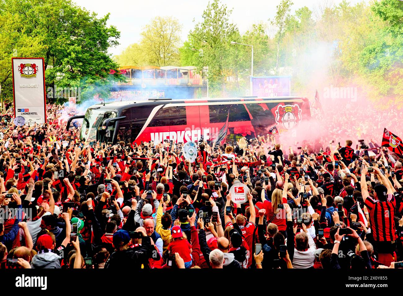 Team arrival with Xabi Alonso in the teambus with celebrating fans before the match  BAYER 04 LEVERKUSEN - SV WERDER BREMEN    on April 14, 2024 in Leverkusen, Germany. Season 2023/2024, 1.Bundesliga,, matchday 29, 29.Spieltag  Photographer: ddp images / star-images      - DFL REGULATIONS PROHIBIT ANY USE OF PHOTOGRAPHS as IMAGE SEQUENCES and/or QUASI-VIDEO - Stock Photo