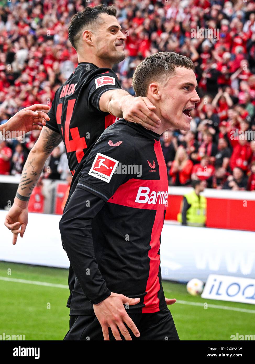 LEVERKUSEN - Florian Wirtz of Bayer 04 Leverkusen celebrates the 3-0 during the Bundesliga match between Bayer 04 Leverkusen and Werder Bremen at the Bay Arena on April 14, 2024 in Leverkusen, Germany. ANP | Hollandse Hoogte | GERRIT VAN COLOGNE Stock Photo