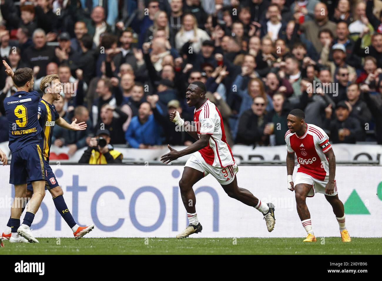 AMSTERDAM - (l-r) Ricky van Wolfswinkel of FC Twente, Michel Vlap of FC Twente, Brian Brobbey of Ajax celebrates the 1-1, Steven Bergwijn of Ajax during the Dutch Eredivisie match between Ajax Amsterdam and FC Twente in the Johan Cruijff ArenA on 14 April 2024 in Amsterdam, Netherlands. ANP | Hollandse Hoogte | MAURICE VAN STEEN Stock Photo