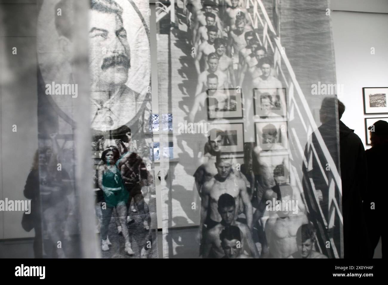 Moscow, Russia. 12th of April, 2024. People watches the exhibition 'Sport in photography from Rodchenko to the present day' at the Multimedia Art Museum which reopening after major renovation, in Moscow, Russia. Credit: Nikolay Vinokurov/Alamy Live News Stock Photo