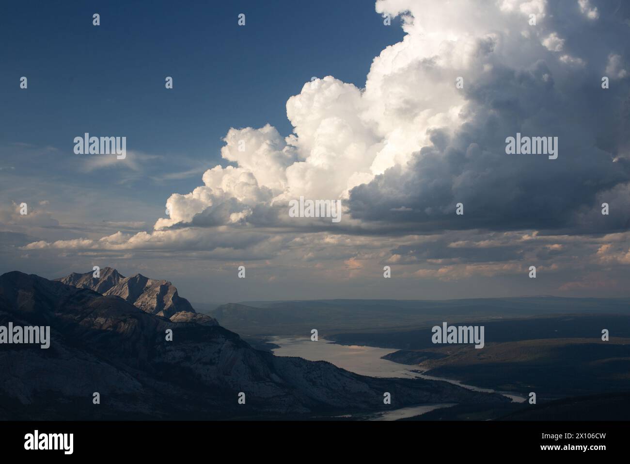 Dramatic cumulus storm clouds forming on the eastern edge of the Alberta Rocky Mountains in Jasper National Park. Stock Photo