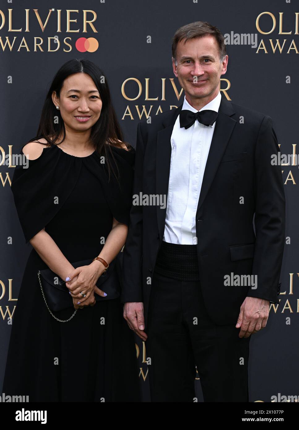 London, UK. April 14th, 2024. Lucia Hunt and Jeremy Hunt arriving at The Olivier Awards, Royal Albert Hall. Credit: Doug Peters/EMPICS/Alamy Live News Stock Photo