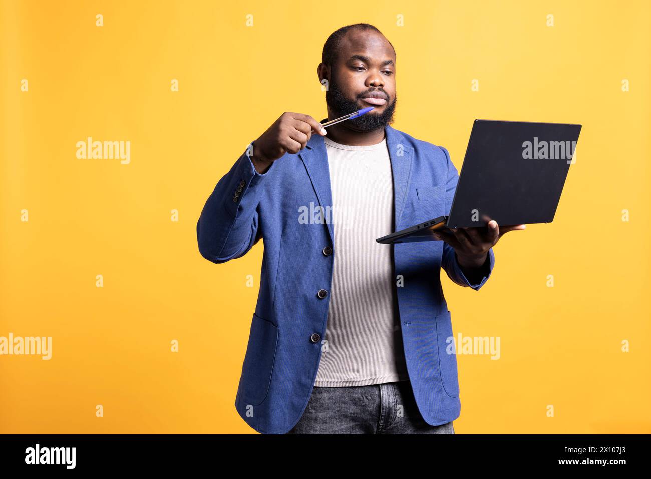African american man composing email typing on laptop keyboard