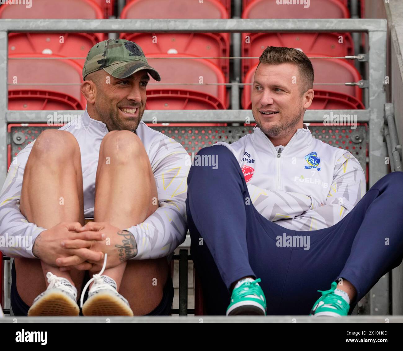 Paul Vaughan and Josh Drinkwater of Warrington Wolves watch from the stands before the Betfred Challenge Cup Quarter Final match St Helens vs Warrington Wolves at Totally Wicked Stadium, St Helens, United Kingdom, 14th April 2024  (Photo by Steve Flynn/News Images) Stock Photo