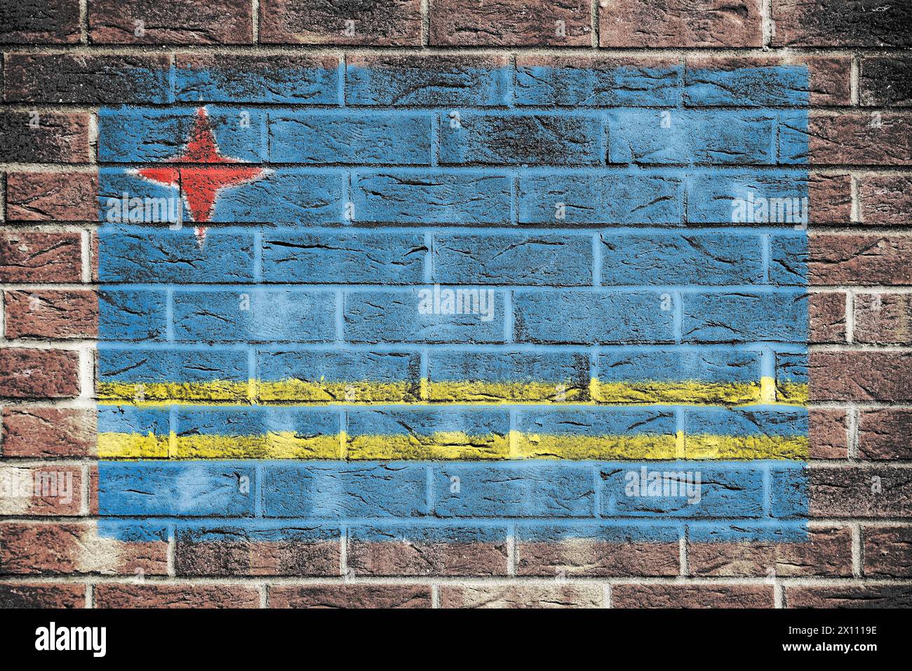 Aruba flag on a brick wall background Stock Photo - Alamy