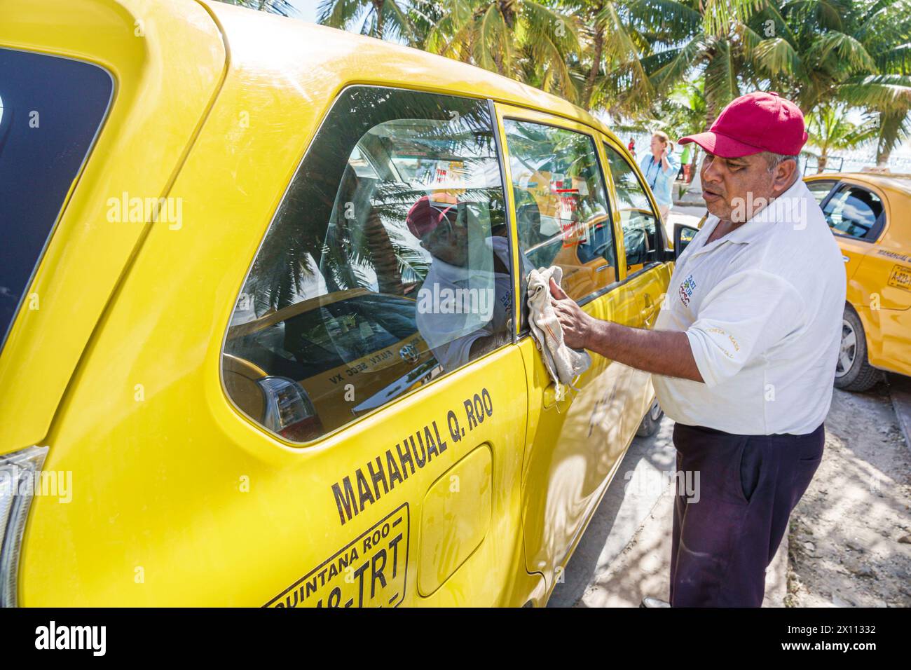 Costa Maya Mexico,Cruise Port,Norwegian Joy Cruise Line ship,7-day Caribbean Sea itinerary,Playa Mahahual Beach Malecon,taxi cab stand,Hispanic man dr Stock Photo