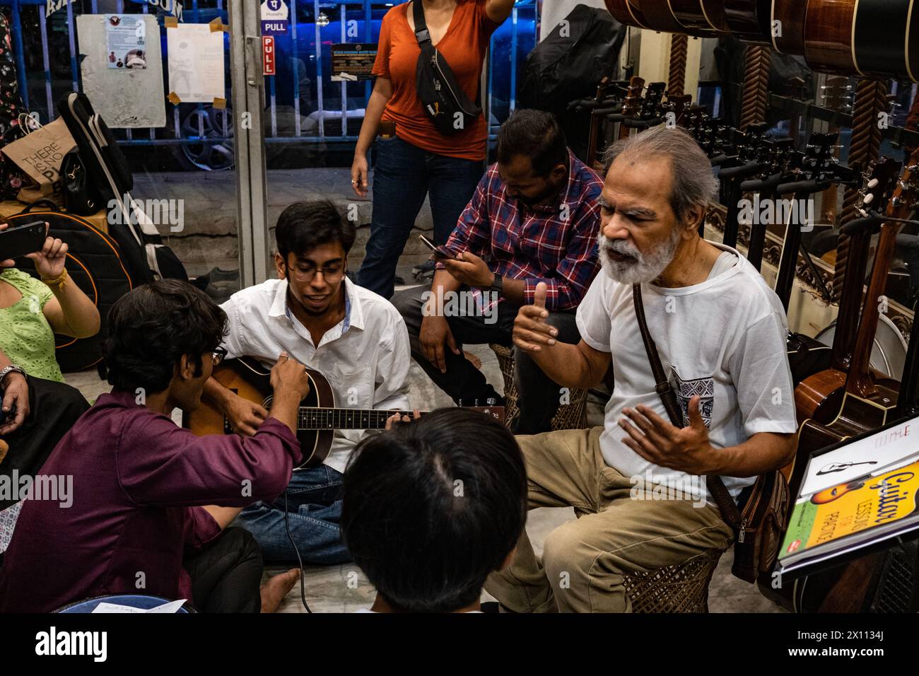 Kolkata, India. 14th Apr, 2024. Several new Bengali musical band have been emerging this year. A new revolution can be seen in Bengali band music based on changing the taste music in young generation has been emerging. A new Bengali psycodelic bule based band names "The Mahanagar" releases its first song in local music instrument store. Pradip Chatterjee (Bulada), a member of "Mohiner Ghoraguli" (One of the oldest music band based in Kolkata) also present in this event. (Photo by Swattik Jana/Pacific Press) Credit: Pacific Press Media Production Corp./Alamy Live News Stock Photo