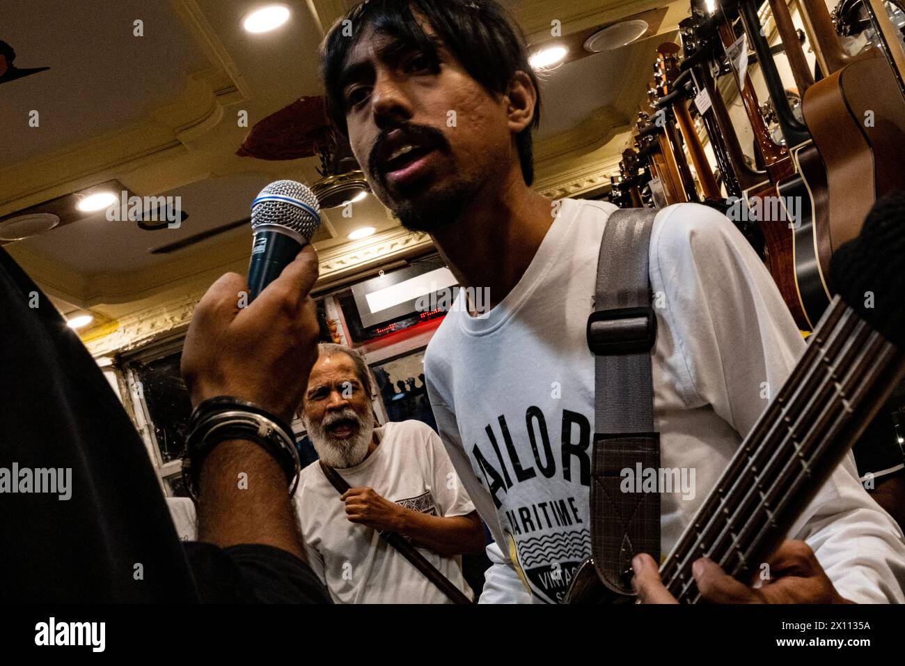 Kolkata, India. 14th Apr, 2024. Several new Bengali musical band have been emerging this year. A new revolution can be seen in Bengali band music based on changing the taste music in young generation has been emerging. A new Bengali psycodelic bule based band names 'The Mahanagar' releases its first song in local music instrument store. Pradip Chatterjee (Bulada), a member of 'Mohiner Ghoraguli' (One of the oldest music band based in Kolkata) also present in this event. (Photo by Swattik Jana/Pacific Press) Credit: Pacific Press Media Production Corp./Alamy Live News Stock Photo