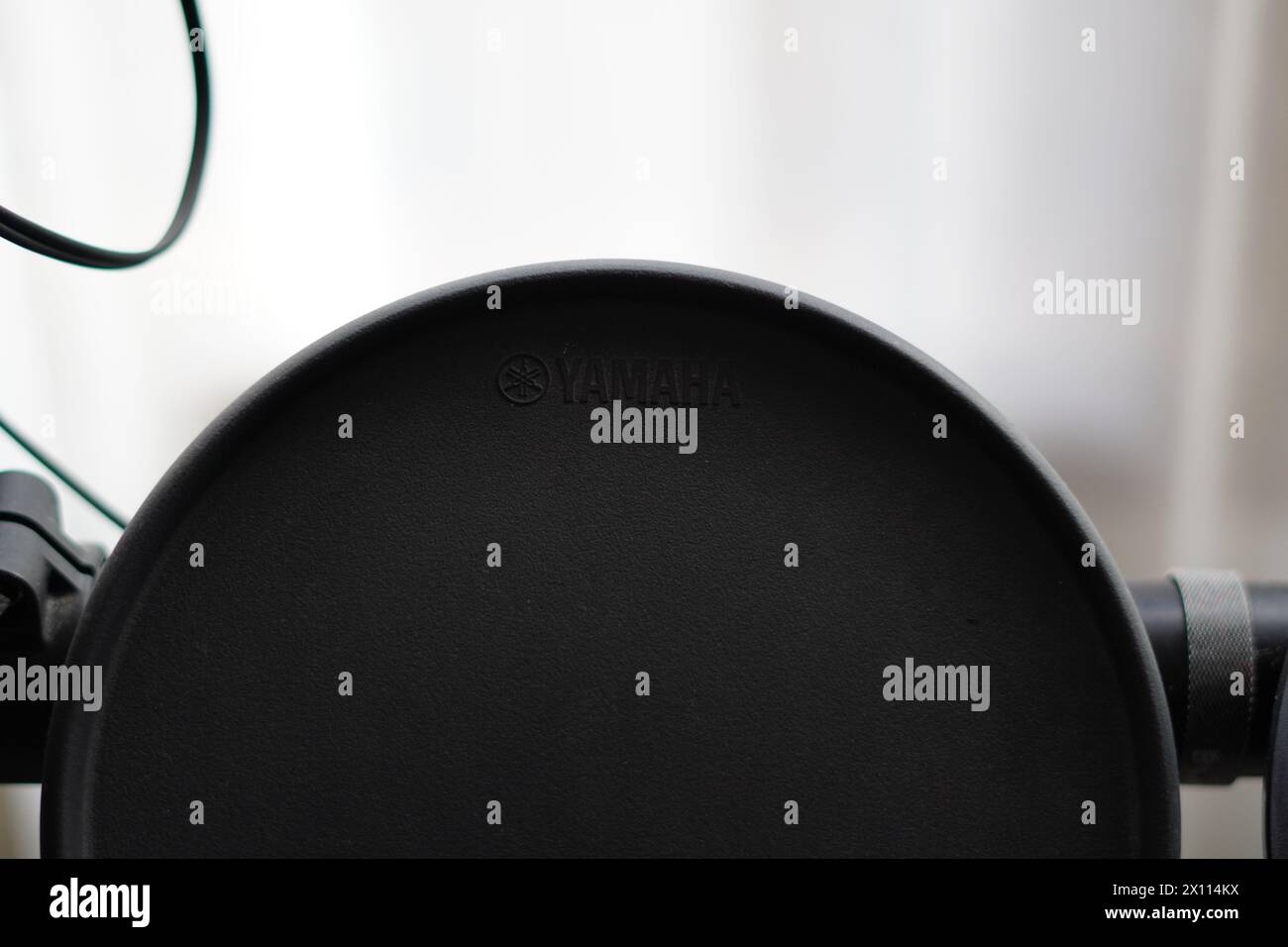 Yamaha logo on the pad of the dtx series drum with a blurred white background Stock Photo