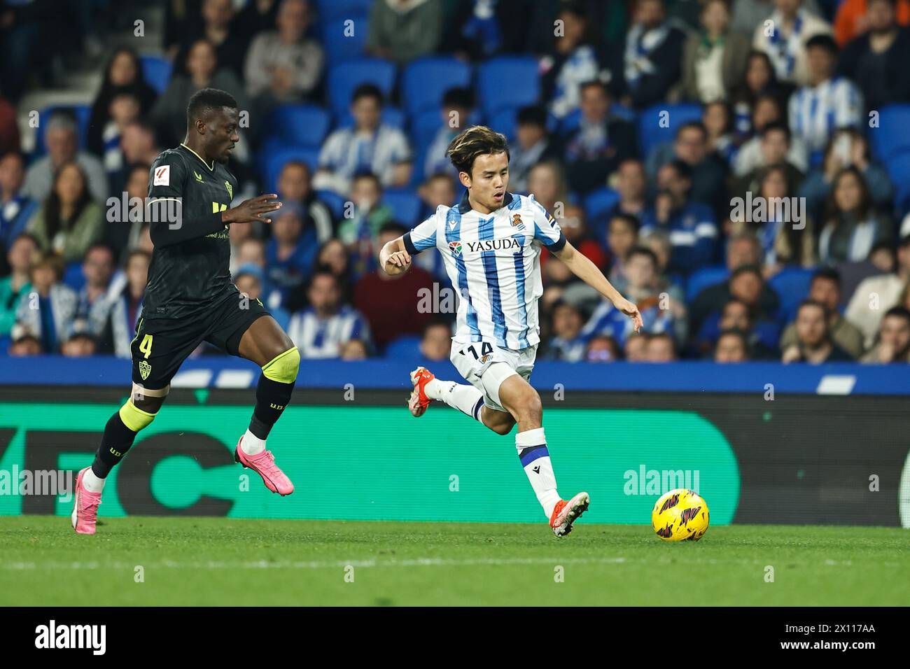 San Sebastian, Spain. 14th Apr, 2024. (L-R) Iddrisu Baba (Almeria), Takefusa Kubo (Sociedad) Football/Soccer : Spanish 'LaLiga EA Sports' match between Real Sociedad 2-2 UD Almeria at the Reale Arena in San Sebastian, Spain . Credit: Mutsu Kawamori/AFLO/Alamy Live News Stock Photo