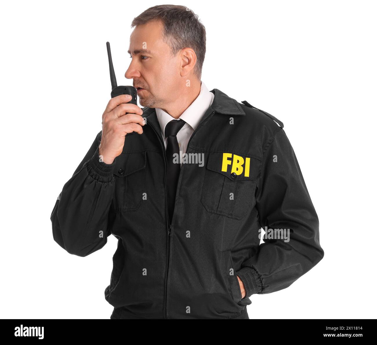 Mature FBI agent with two-way radio on white background Stock Photo - Alamy