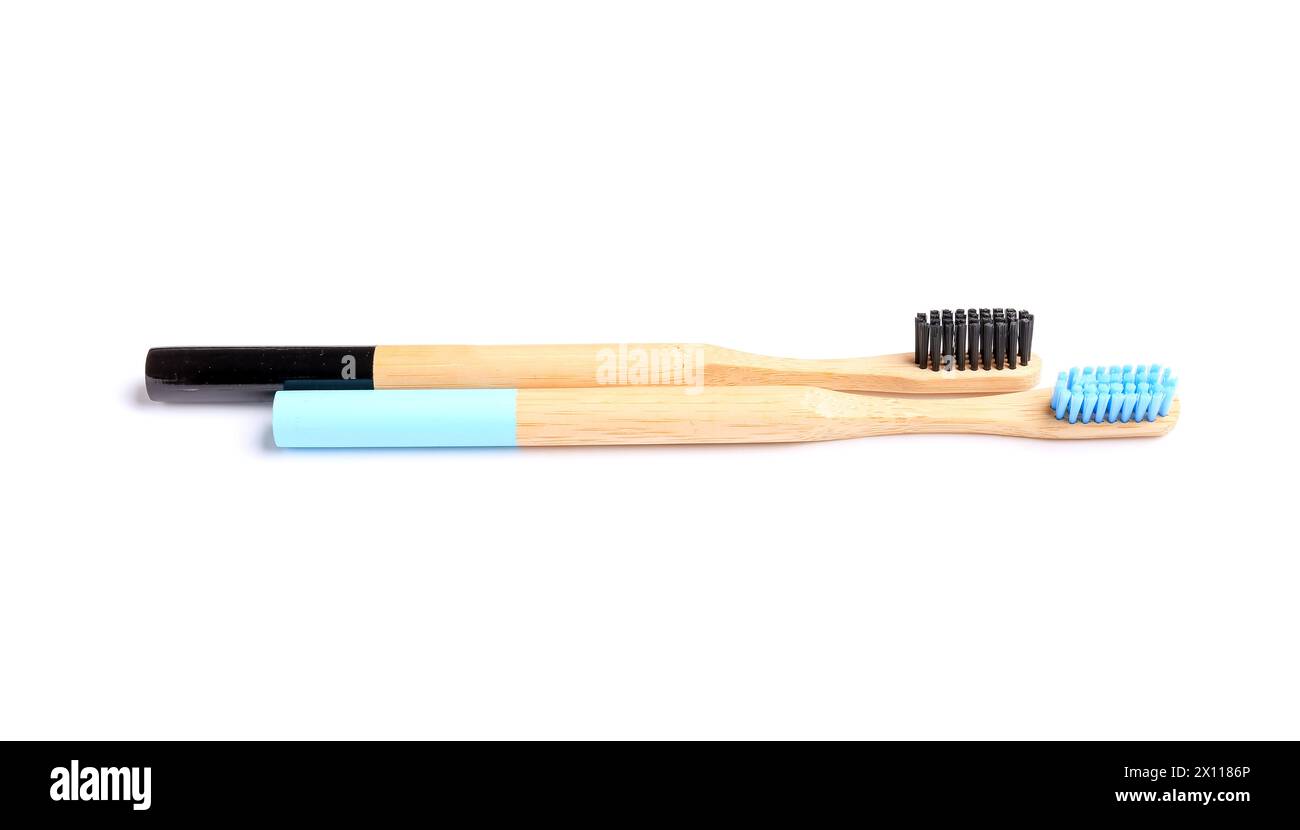 Wooden toothbrushes on white background Stock Photo - Alamy