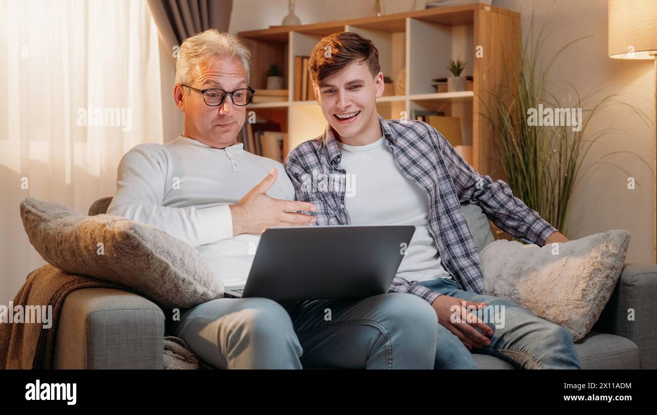Online meeting. Family communication. Happy father and son talking by ...