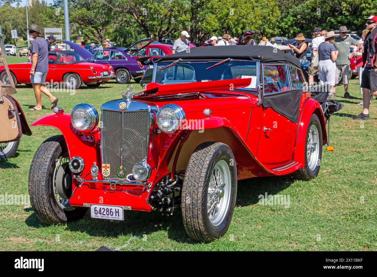 A red MG T type sports car on display at the 2024 Centenary National