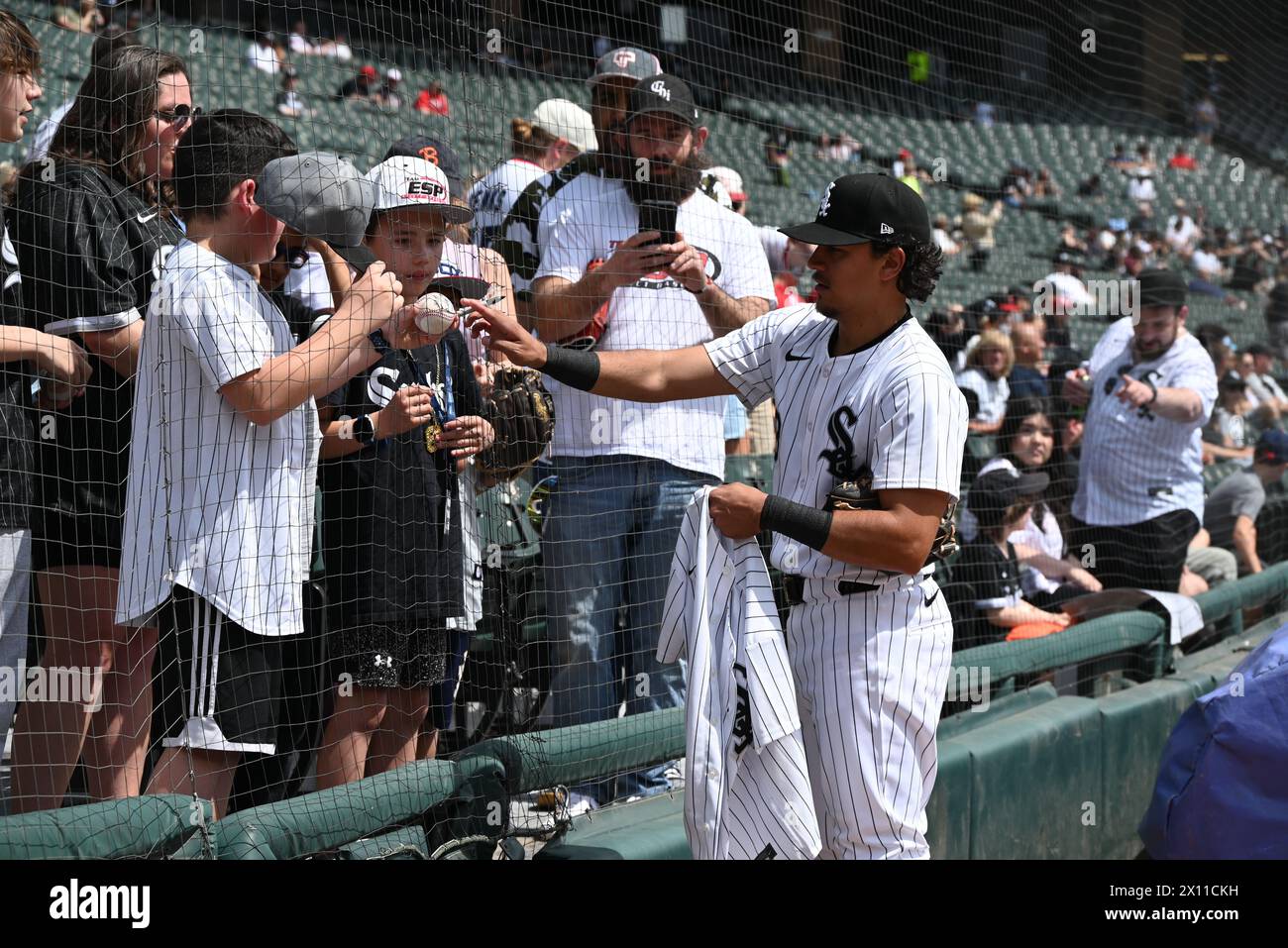 Chicago, United States. 14th Apr, 2024. Nicky Lopez, #8 of the Chicago White Sox signing and autographing baseballs and other items in Sunday's Major League Baseball game where the Cincinnati Reds are playing against the Chicago White Sox at Guaranteed Rate Field in Chicago, Illinois, United States on April 14, 2024. The Cincinnati Reds swept the Chicago White Sox for all three games of the series, they won Sunday's game with a score of 11-4. Credit: SOPA Images Limited/Alamy Live News Stock Photo