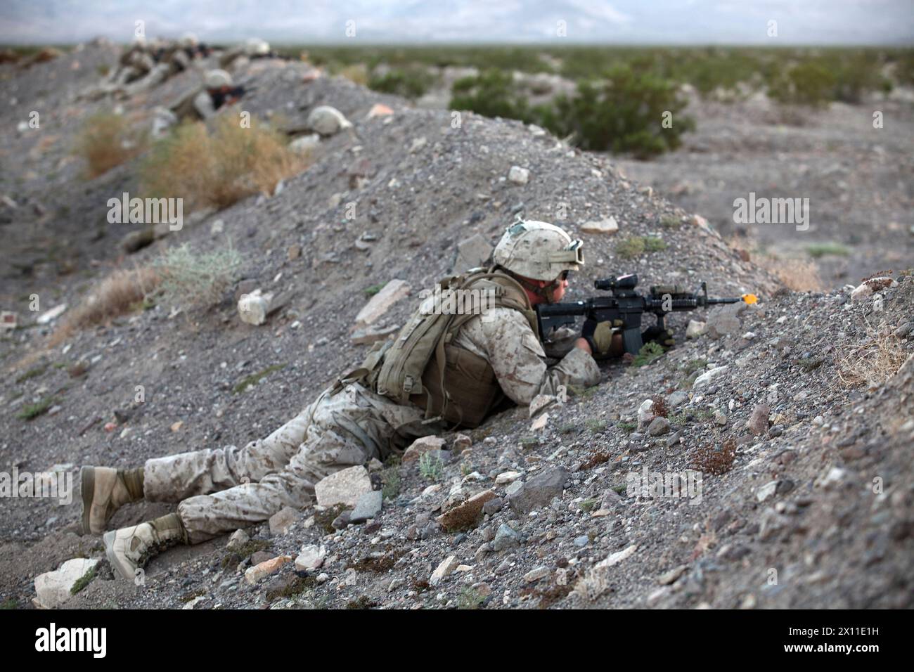 U.S. Marines with Transportation Support Company, Combat Logistics Regiment 2, 2nd Marine Logistics Group, hold security while executing a movement rehearsal exercise during Enhanced Mojave Viper (EMV), on Marine Corps Air Ground Combat Center Twentynine Palms, CA, Sept. 25, 2012. The Marines participate in EMV in order to build unit cohesion and  tactical proficiency in preparation for deployment in support of Operation Enduring Freedom MAGTF. Stock Photo